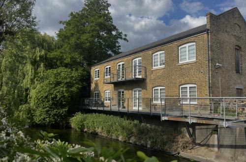 Desk spaces available in unique Earlsfield location, overlooking the river Wandle, in a converted Victorian Sawmill